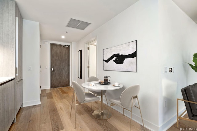 201 Folsom St Unit 2A, San Francisco, CA 94105 - dining space with baseboards, light wood-type flooring, and recessed lighting