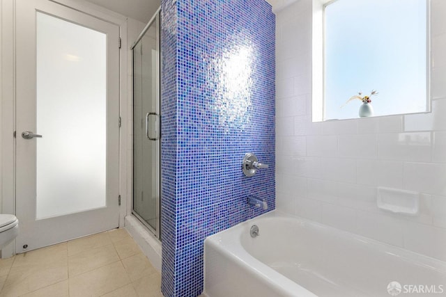 bathroom with independent shower and bath, tile patterned floors, and toilet