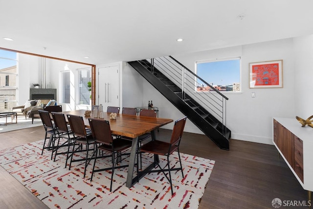 dining area with dark wood-type flooring