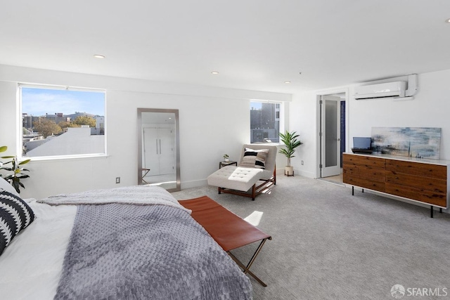 bedroom with light carpet and a wall unit AC