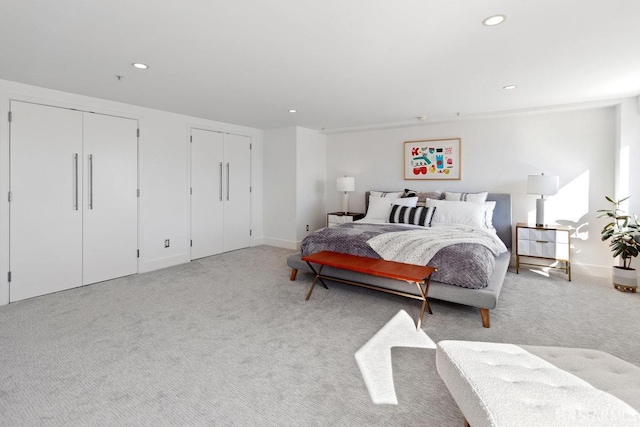 carpeted bedroom with two closets