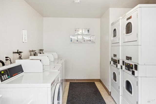 148 Larkspur Plaza Dr, Larkspur, CA 94939 - shared laundry room with estacked washer and dryer, independent washer and dryer, and baseboards