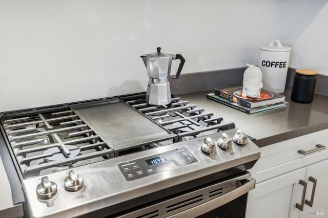 148 Larkspur Plaza Dr, Larkspur, CA 94939 - kitchen view of stainless steel gas range oven and white cabinets