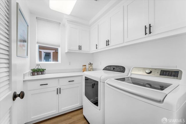 114 Emerald Cove Ter, San Francisco, CA 94134 - washroom featuring washing machine and dryer, cabinet space, and wood finished floors