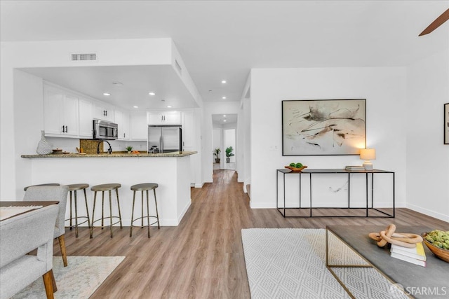 114 Emerald Cove Ter, San Francisco, CA 94134 - living room featuring light wood-style flooring, recessed lighting, and baseboards