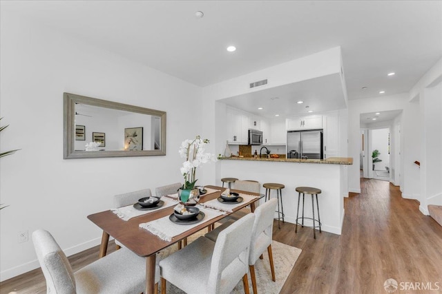 114 Emerald Cove Ter, San Francisco, CA 94134 - dining area featuring light wood-type flooring, baseboards, and recessed lighting