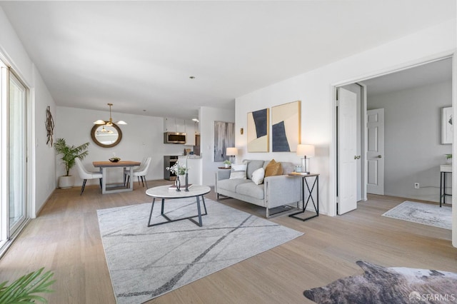 389 Belmont St Unit 306, Oakland, CA 94610 - living area with light wood finished floors