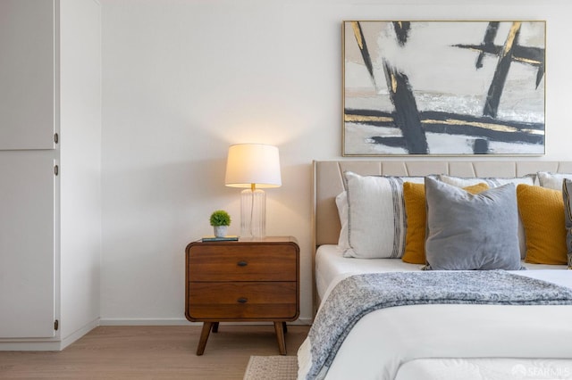 389 Belmont St Unit 306, Oakland, CA 94610 - bedroom featuring wood finished floors and baseboards