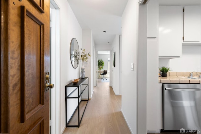 389 Belmont St Unit 306, Oakland, CA 94610 - corridor featuring light wood-style flooring and baseboards