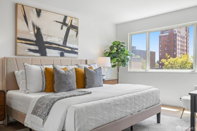 389 Belmont St Unit 306, Oakland, CA 94610 - bedroom featuring wood finished floors and a city view