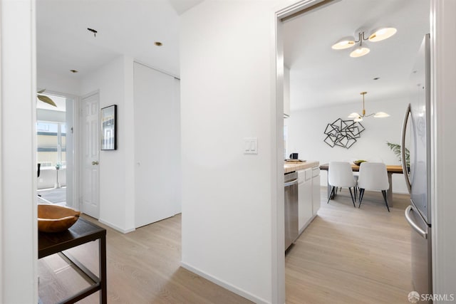 389 Belmont St Unit 306, Oakland, CA 94610 - hall featuring light wood finished floors and baseboards