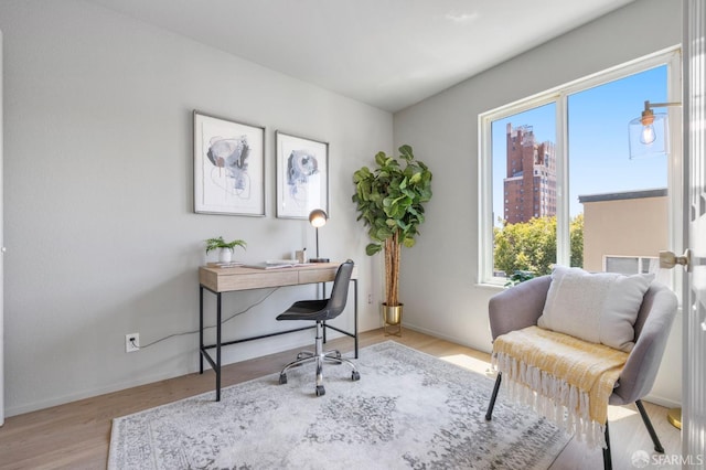 389 Belmont St Unit 306, Oakland, CA 94610 - office area with healthy amount of natural light and light wood-style floors