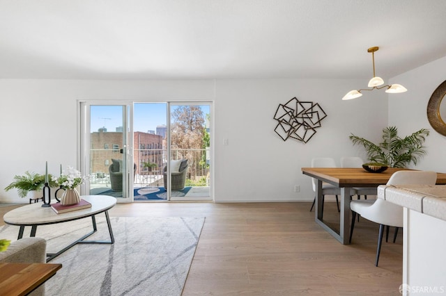 389 Belmont St Unit 306, Oakland, CA 94610 - living area featuring wood finished floors and a chandelier