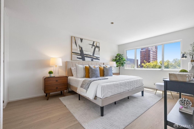 389 Belmont St Unit 306, Oakland, CA 94610 - bedroom featuring light wood-type flooring and baseboards