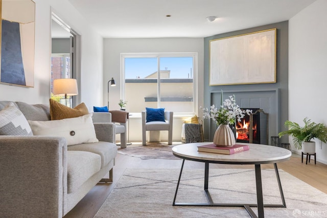 389 Belmont St Unit 306, Oakland, CA 94610 - living room with wood finished floors and a tile fireplace