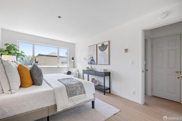 389 Belmont St Unit 306, Oakland, CA 94610 - bedroom with light wood-type flooring and baseboards