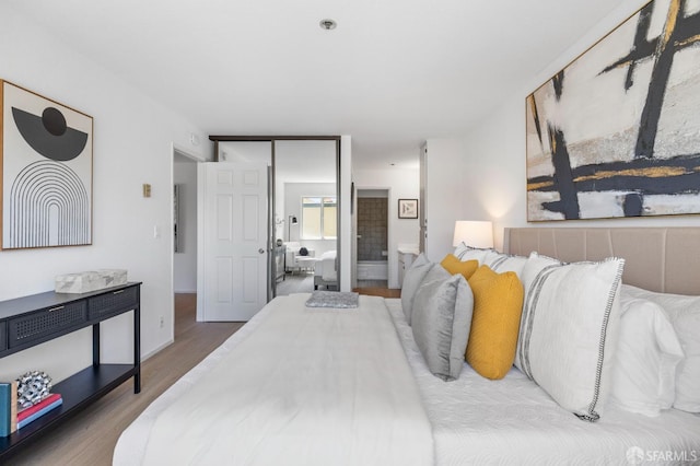 389 Belmont St Unit 306, Oakland, CA 94610 - bedroom with wood finished floors and connected bathroom