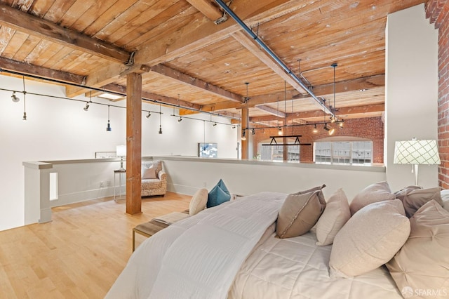 355 Bryant St Unit 411, San Francisco, CA 94107 - bedroom featuring a wooden ceiling with exposed beams, wood finished floors, and brick wall