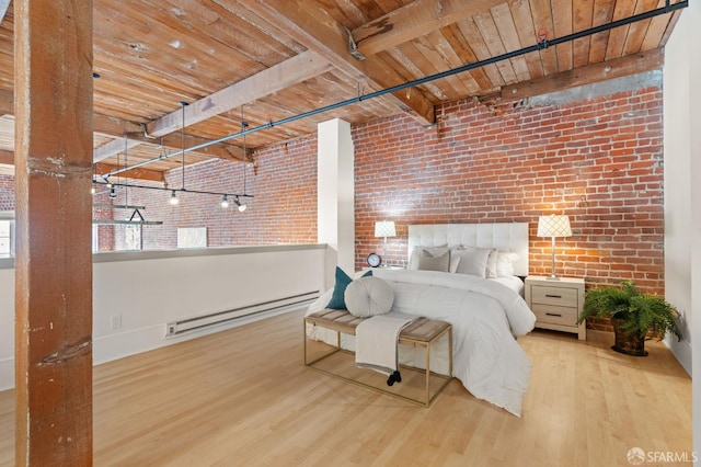 355 Bryant St Unit 411, San Francisco, CA 94107 - bedroom with a baseboard radiator, brick wall, wood finished floors, and a wood ceiling with exposed beams