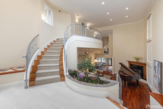 110 Sheridan Rd, Oakland, CA 94618 - entrance foyer featuring a fireplace, recessed lighting, stairway, ornamental molding, and baseboards