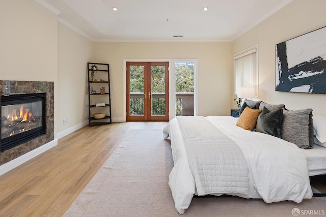 110 Sheridan Rd, Oakland, CA 94618 - bedroom featuring light wood-style flooring, crown molding, a fireplace, recessed lighting, and baseboards