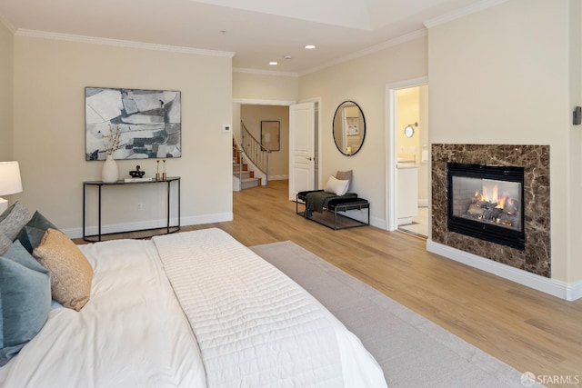 110 Sheridan Rd, Oakland, CA 94618 - bedroom featuring light wood-type flooring, recessed lighting, ornamental molding, baseboards, and a premium fireplace