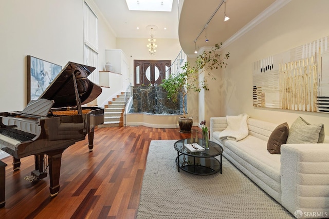 110 Sheridan Rd, Oakland, CA 94618 - foyer with wood finished floors, track lighting, crown molding, a chandelier, and a skylight