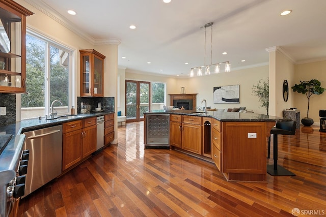 110 Sheridan Rd, Oakland, CA 94618 - kitchen featuring beverage cooler, stainless steel dishwasher, a sink, dark wood-type flooring, and recessed lighting