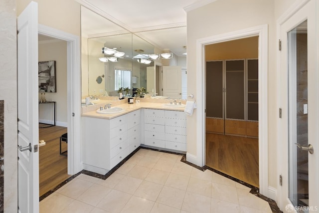 110 Sheridan Rd, Oakland, CA 94618 - bathroom with tile patterned flooring, double vanity, crown molding, and baseboards