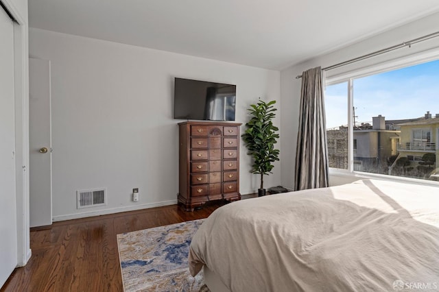 bedroom featuring dark wood-type flooring