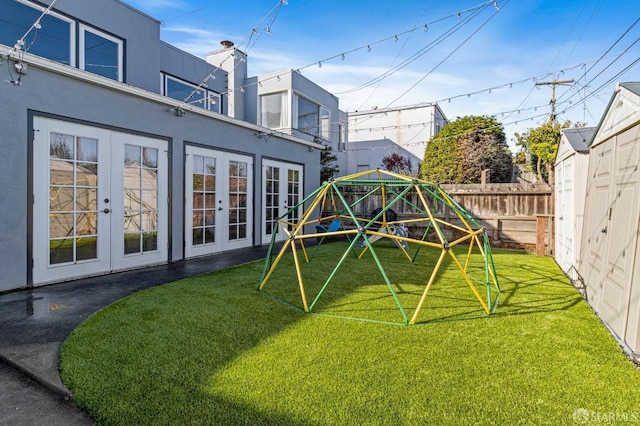 exterior space featuring french doors and a playground