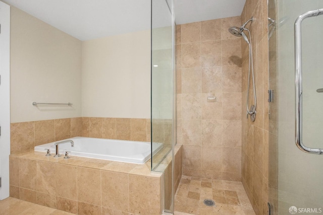 bathroom with plus walk in shower and tile patterned flooring