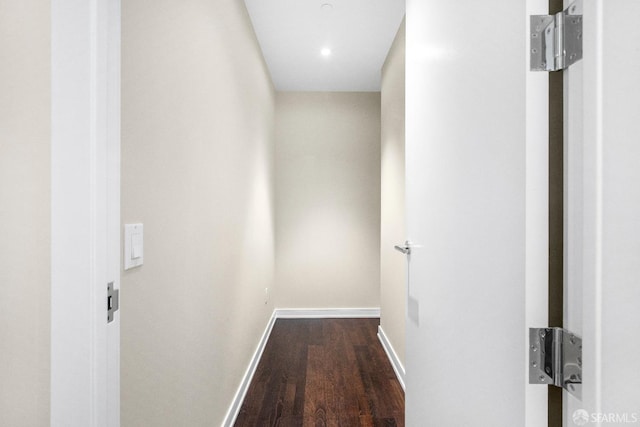 hallway with dark hardwood / wood-style floors