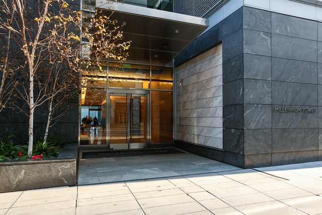 view of exterior entry with a garage