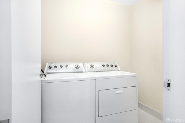 laundry room with independent washer and dryer