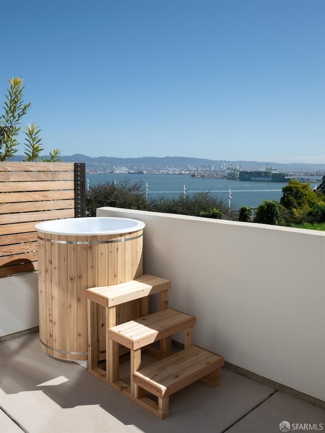 38 Meadow Dr Unit 2, San Francisco, CA 94130 - view of patio featuring a hot tub and a water view