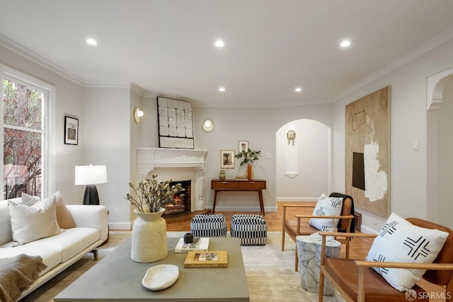 living room with light hardwood / wood-style flooring and ornamental molding