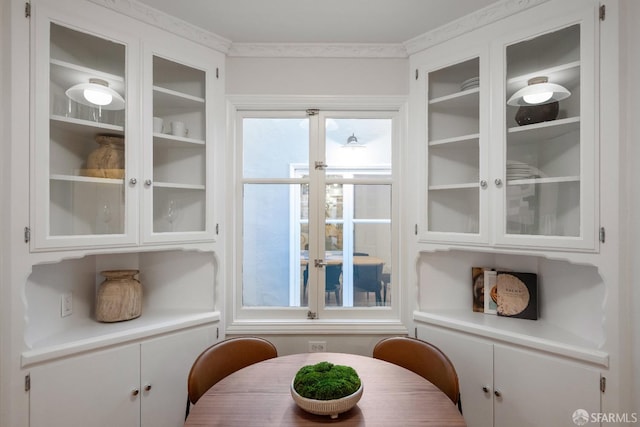 dining area with crown molding