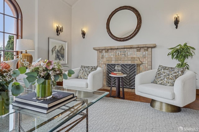 living area featuring vaulted ceiling and a fireplace