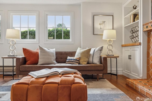 interior space with wood finished floors and baseboards