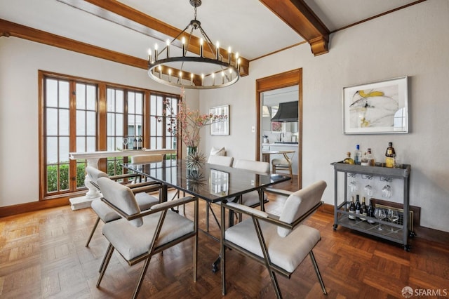 dining room featuring beamed ceiling, baseboards, a bar, and an inviting chandelier