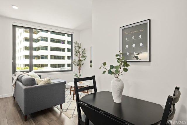 dining area with dark hardwood / wood-style flooring