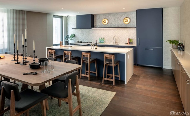 dining room featuring dark hardwood / wood-style flooring and sink