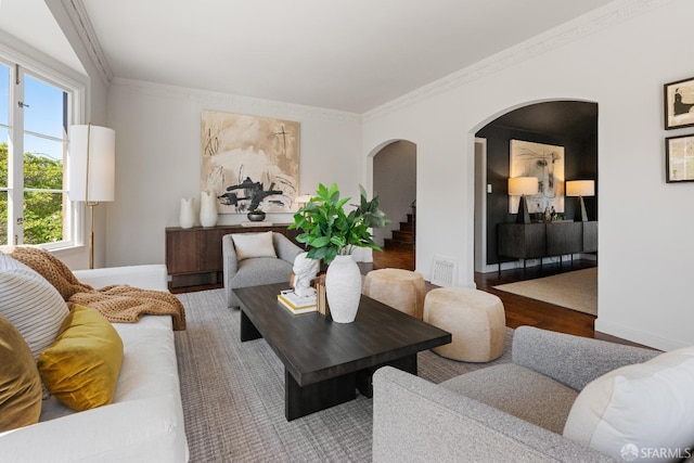 living room with hardwood / wood-style floors and ornamental molding