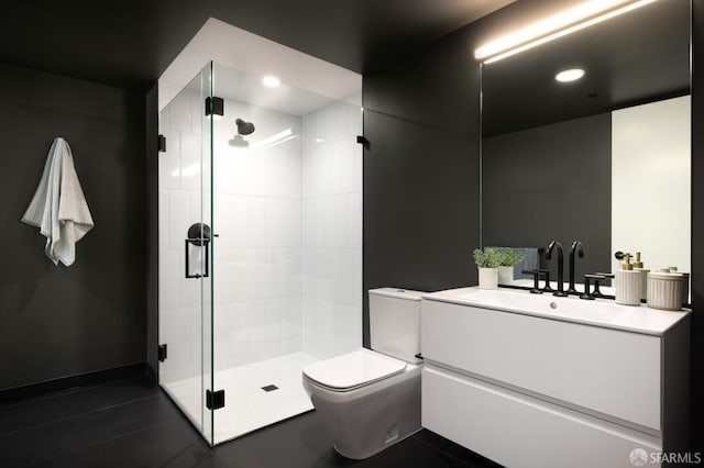 bathroom with tile patterned flooring, an enclosed shower, vanity, and toilet