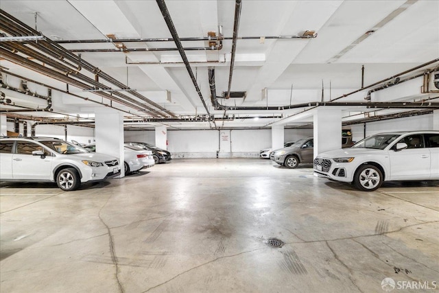 parking garage featuring a garage door opener