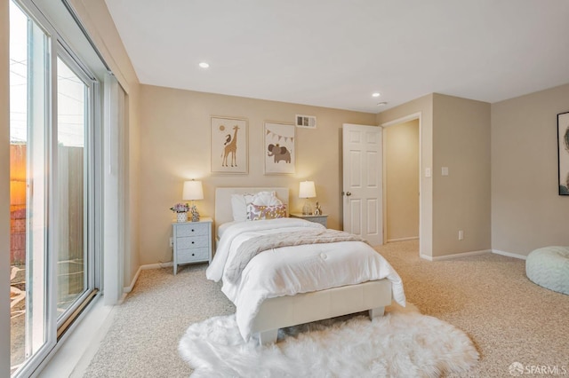 bedroom featuring recessed lighting, light colored carpet, visible vents, and baseboards