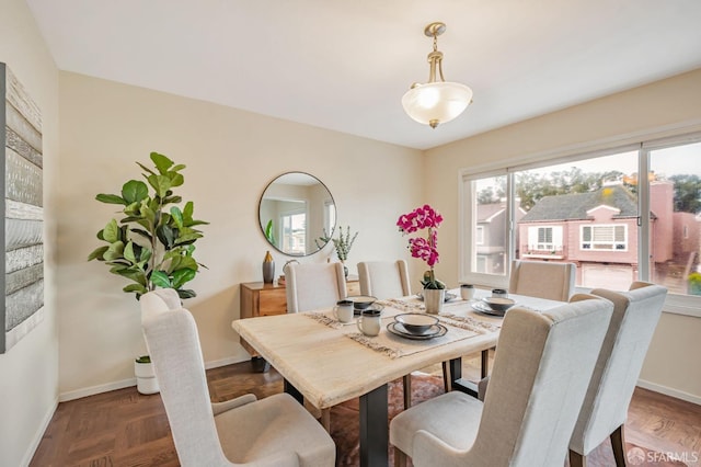 dining space featuring baseboards