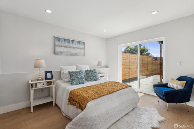2055 42nd Ave, San Francisco, CA 94116 - bedroom featuring access to exterior, wood finished floors, and recessed lighting