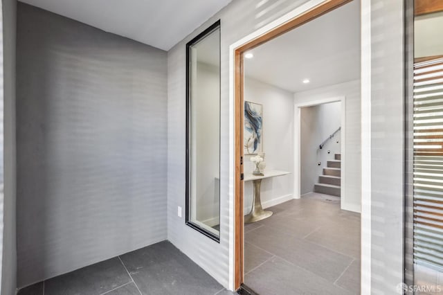 2055 42nd Ave, San Francisco, CA 94116 - corridor with dark tile patterned floors, stairway, and recessed lighting